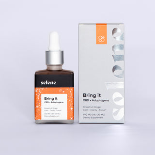 Broad-spectrum cbd and adaptogen tincture bottle with packaging