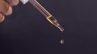 Organic broad-spectrum CBD oil dripping from dropper