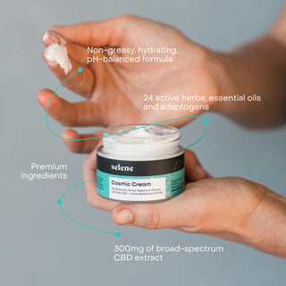 Woman holding CBD cream with non-greasy hydrating texture, 24 active herbs, essential oils, adaptogens, and 300mg CBD
